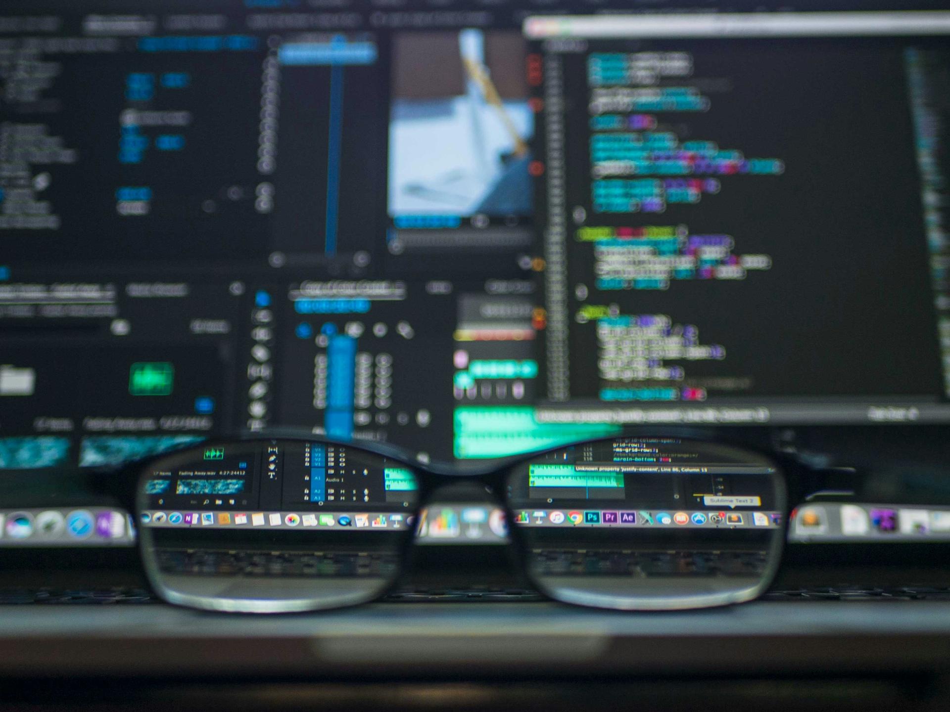 Operators monitoring automated workflows across multiple screens